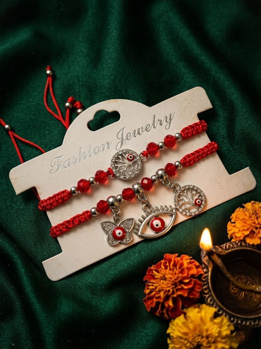 Dhiyona Set Of 2 Red & Silver Evil Eye Design Bhaiya Bhabhi Rakhi With Roli Chawal Chandan