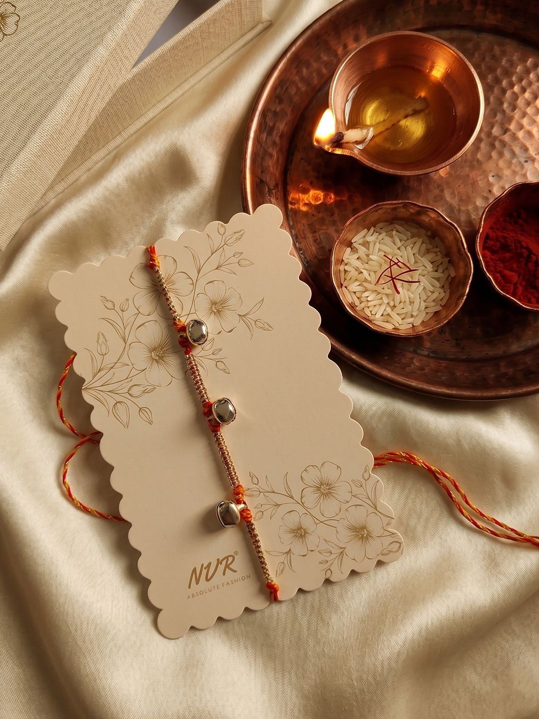 Dhiyona Golden Ghungroo Thread Rakhi With Roli Chawal Chandan Mishri
