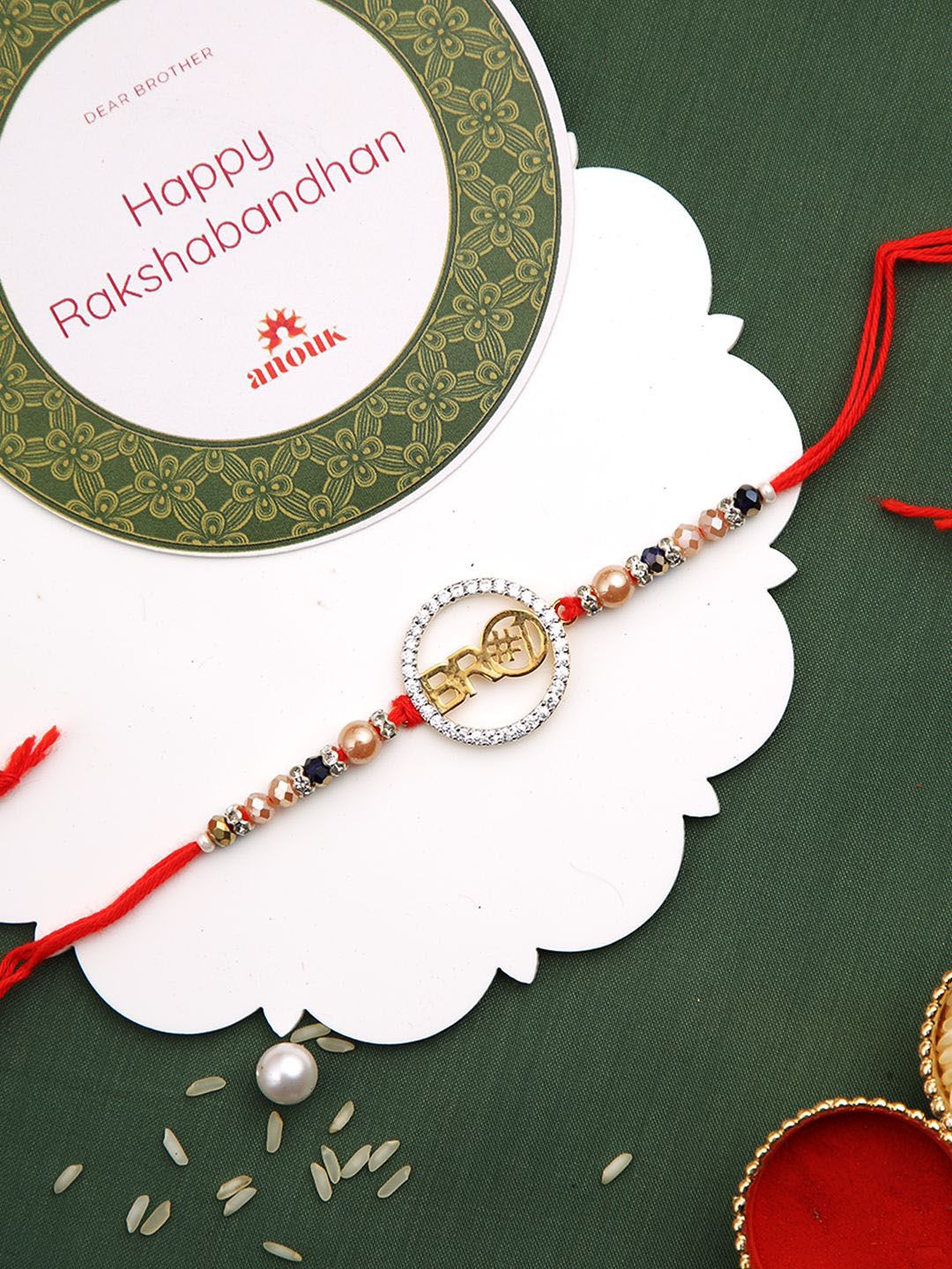 Dhiyona Red Stone Studded & Beaded Thread Rakhi With Roli Chawal & Greeting Card
