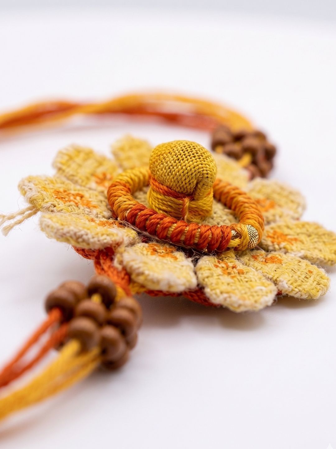 Dhiyona Yellow Floral Seed Thread Rakhi With Roli Chawal Chandan Mishri