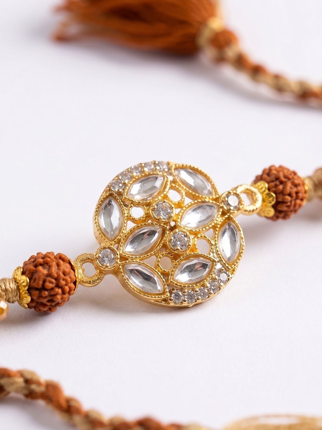Dhiyona Rudraksh & Kundan Studded Gold Toned Thread Rakhi With Roli Chawal Chandan Mishri