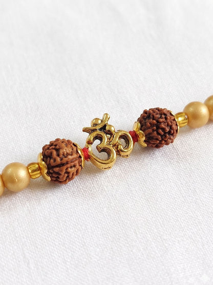 Dhiyona Om Design Rudraksh Thread Rakhi With Roli Chawal Chandan Mishri
