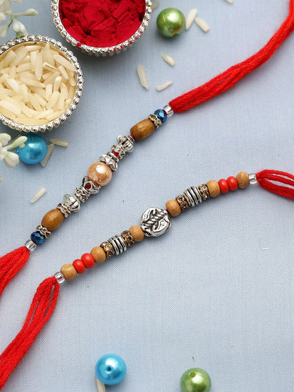 Dhiyona Set Of 2 Silver-Toned Beaded Rakhi With Roli Rice & Greeting Card