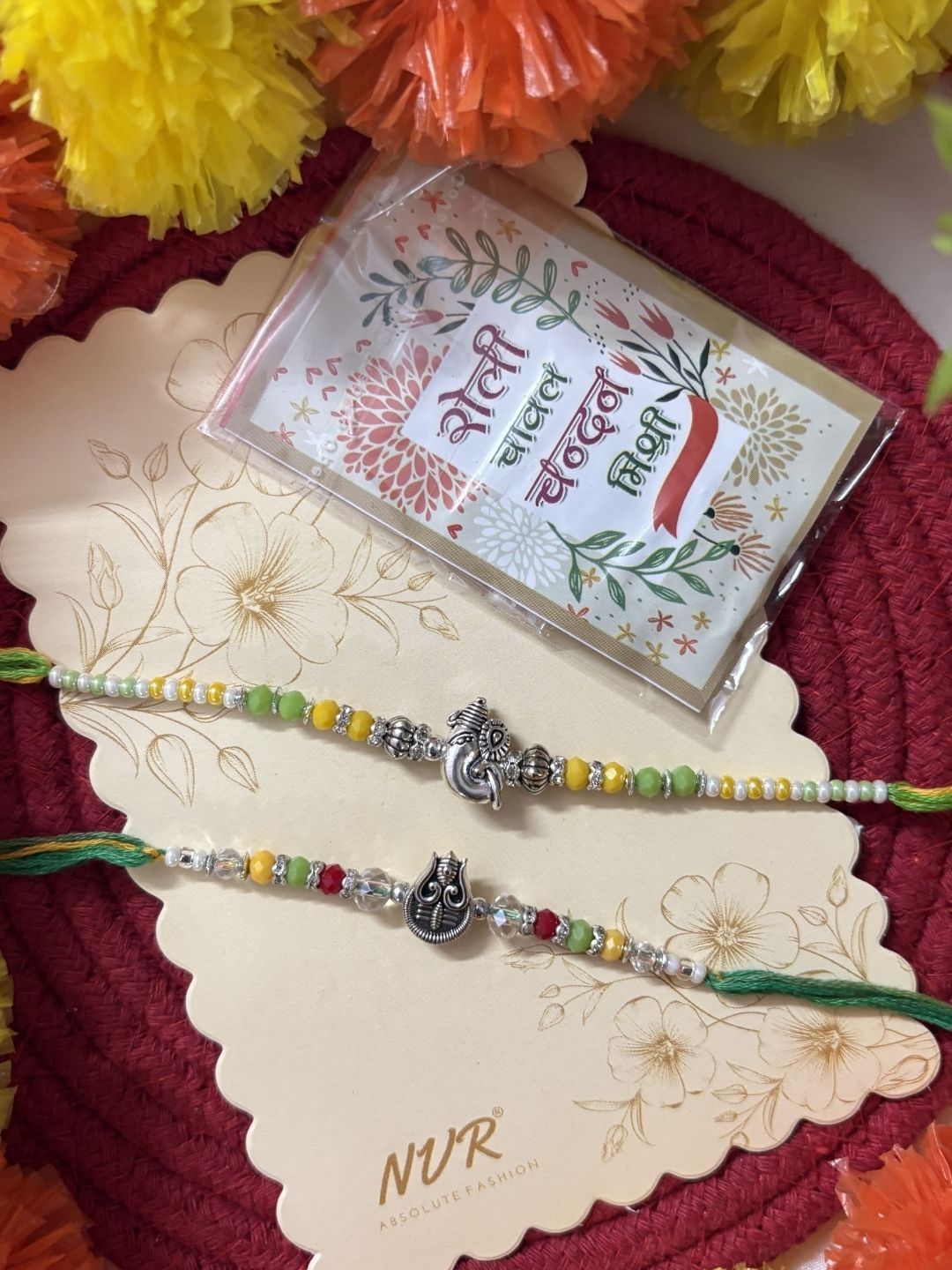 Dhiyona Set Of 2 Multicolor Religious Thread Rakhi With Roli Chawal Chandan Mishri