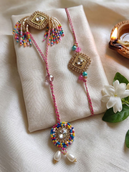 Dhiyona Set Of 2 White Artificial Stones Golden Toned Bhaiya Bhabhi Rakhi With Roli Chawal
