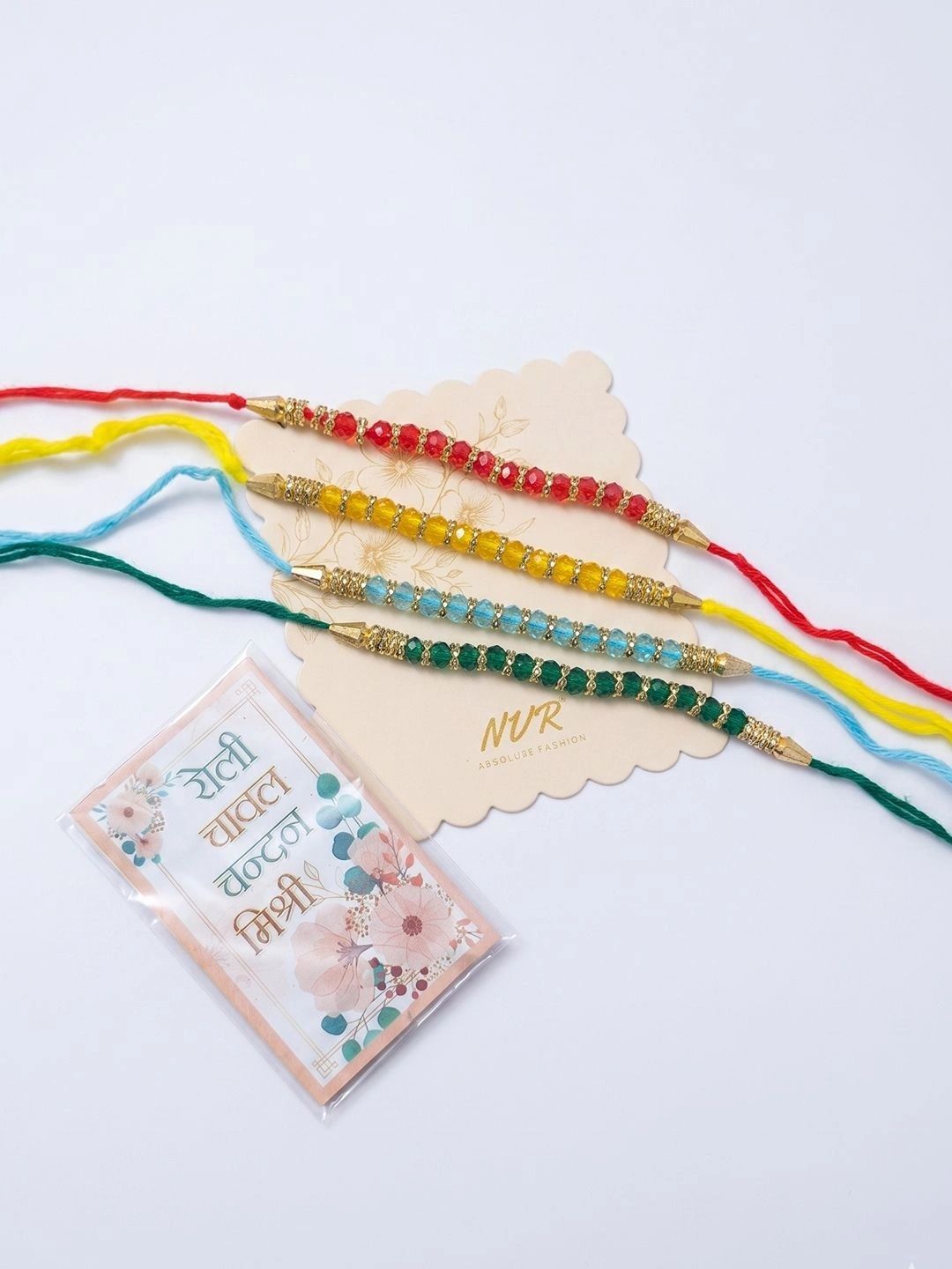 Dhiyona Set Of 4 Multicolor Artificial Beads Thread Rakhi With Roli Chawal Chandan Mishri