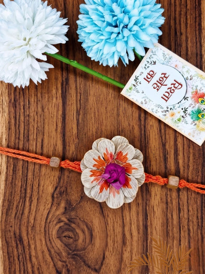 Dhiyona Multicolor Floral Design Plant Seed Rakhi With Roli Chawal Chandan Mishri