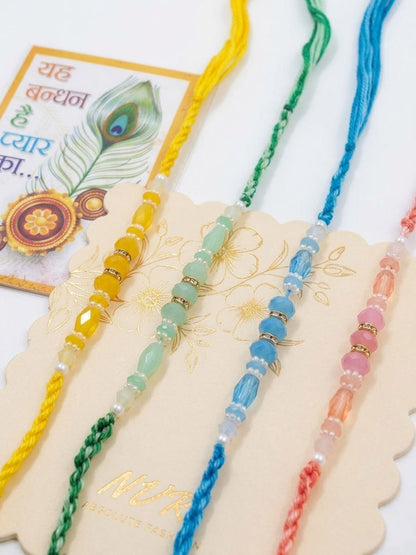 Dhiyona Set Of 4 Multicolor Artificial Beads Thread Rakhi With Roli Chawal Chandan Mishri