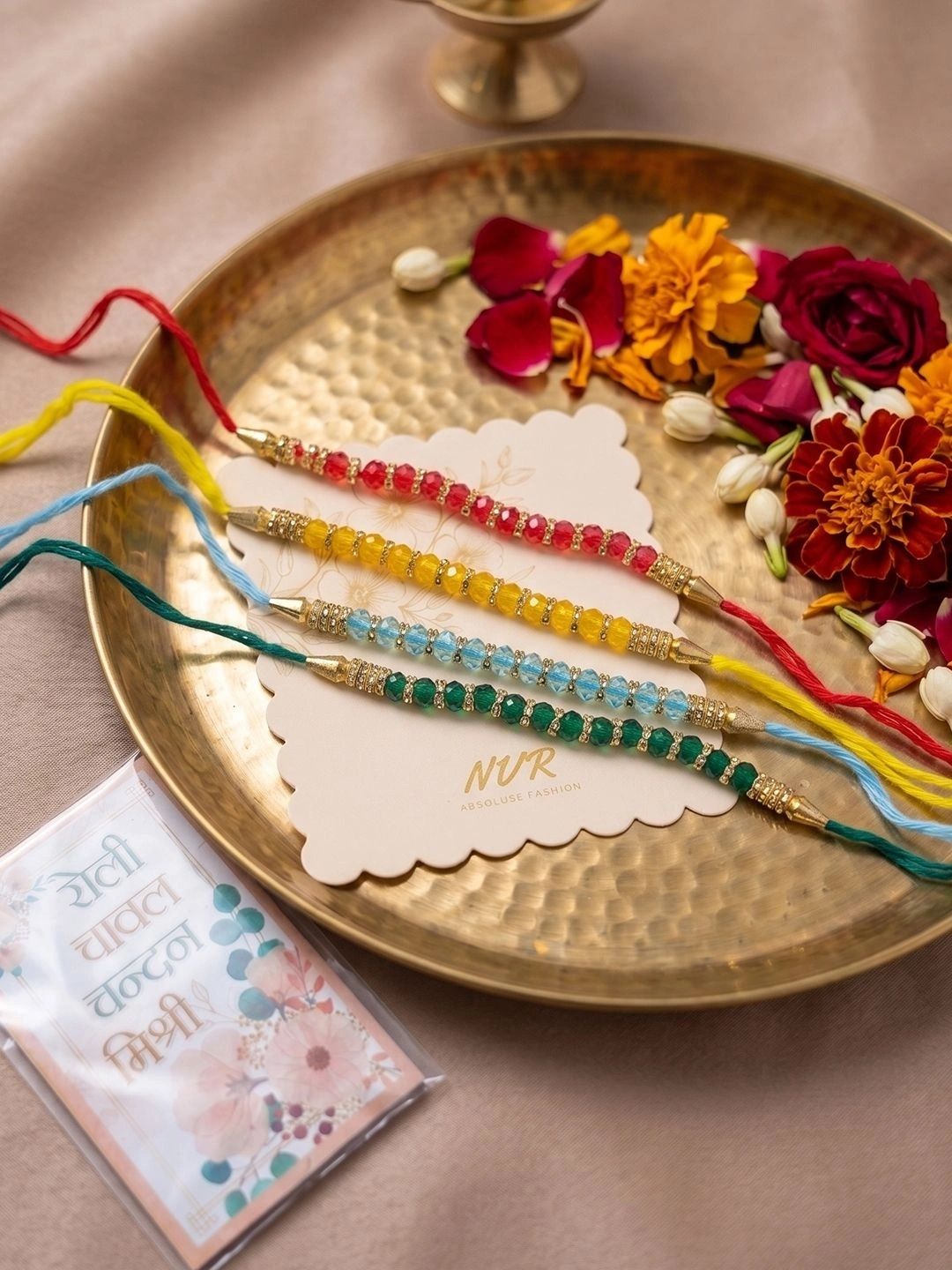 Dhiyona Set Of 4 Multicolor Artificial Beads Thread Rakhi With Roli Chawal Chandan Mishri
