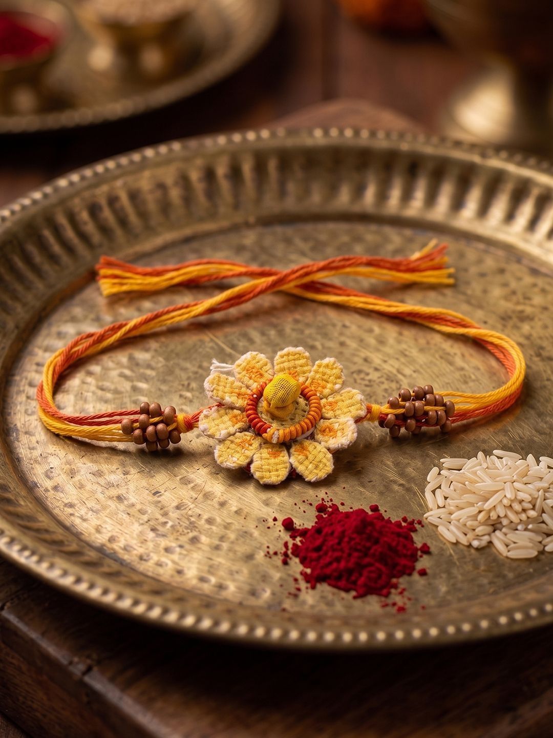 Dhiyona Yellow Floral Seed Thread Rakhi With Roli Chawal Chandan Mishri