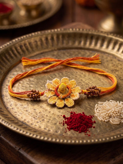Dhiyona Yellow Floral Seed Thread Rakhi With Roli Chawal Chandan Mishri