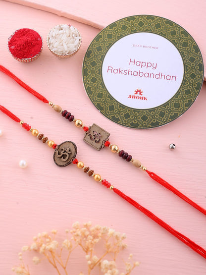 Dhiyona Set Of 2 Red Wooden Om Beaded Rakhi With Roli Rice & Greeting Card