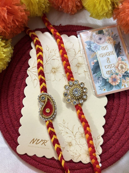 Dhiyona Set Of 2 Gold & Red Thread & Kundan Rakhi With Roli Chawal Chandan Mishri