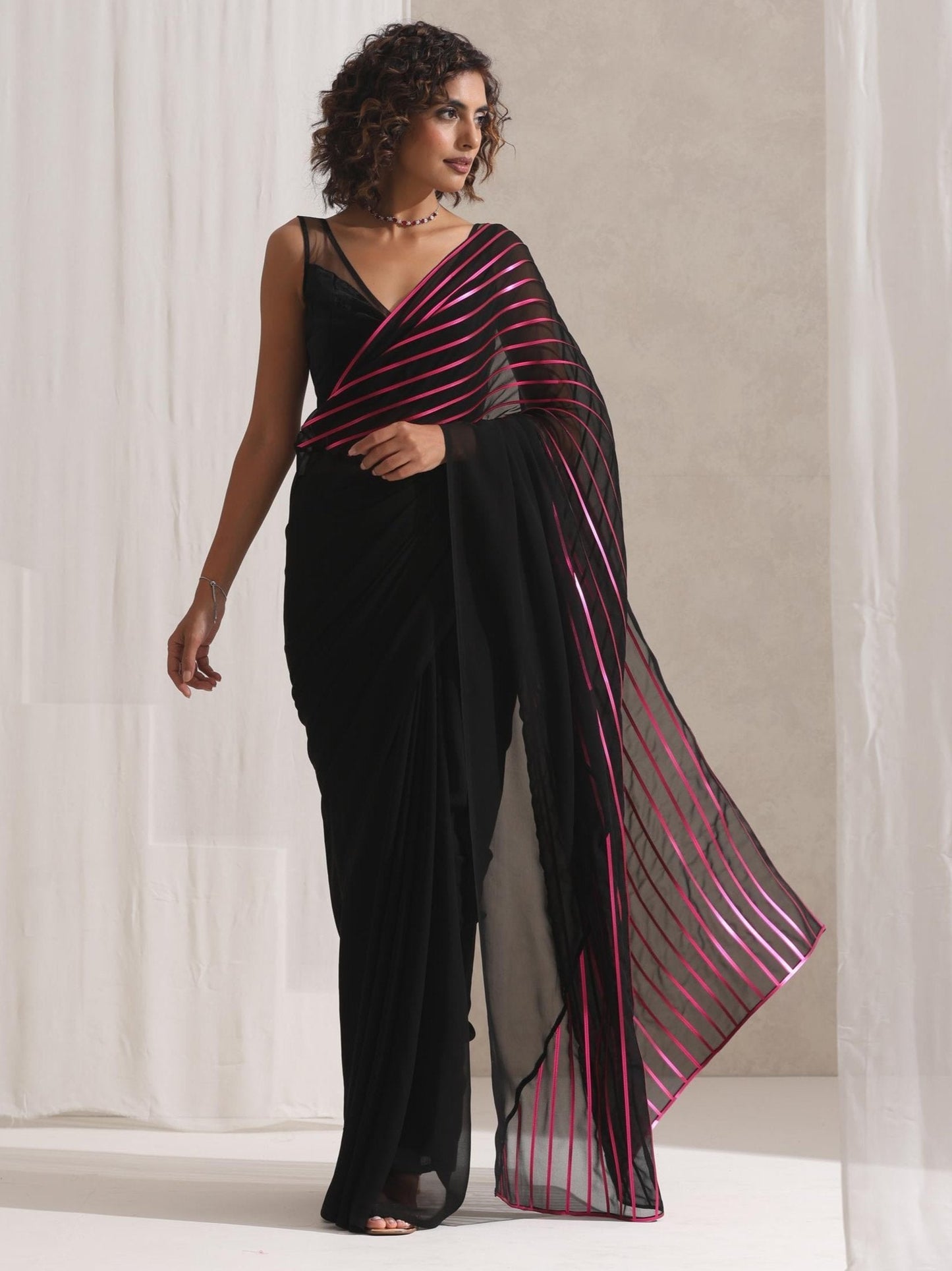 Dhiyona ST Black and Pink Impression Georgette Saree