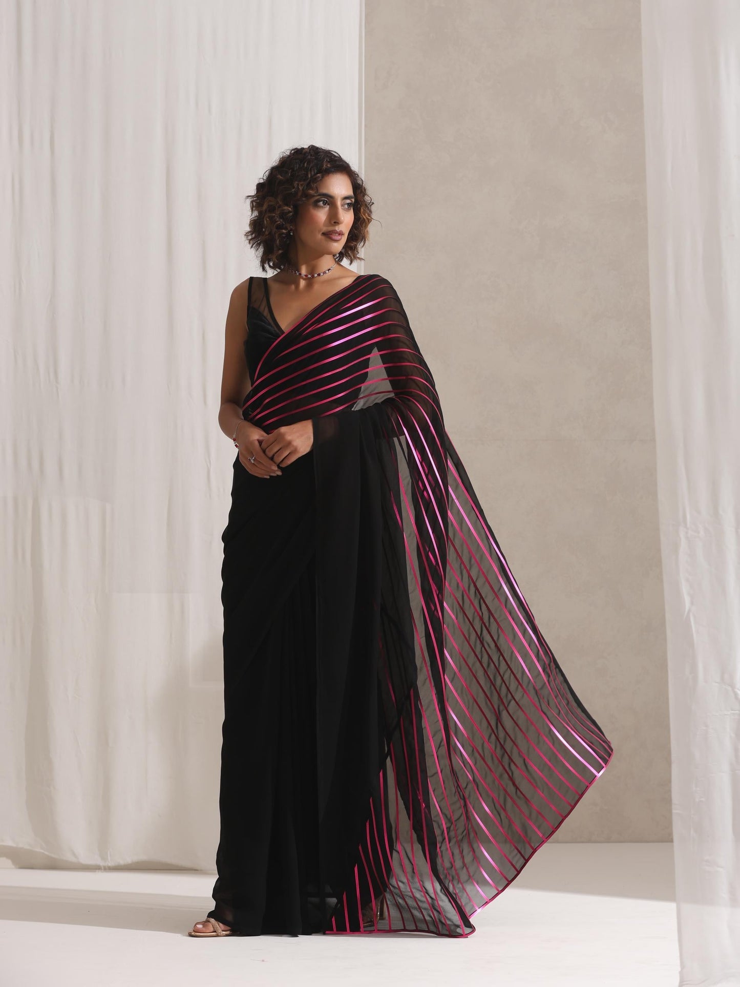 Dhiyona ST Black and Pink Impression Georgette Saree