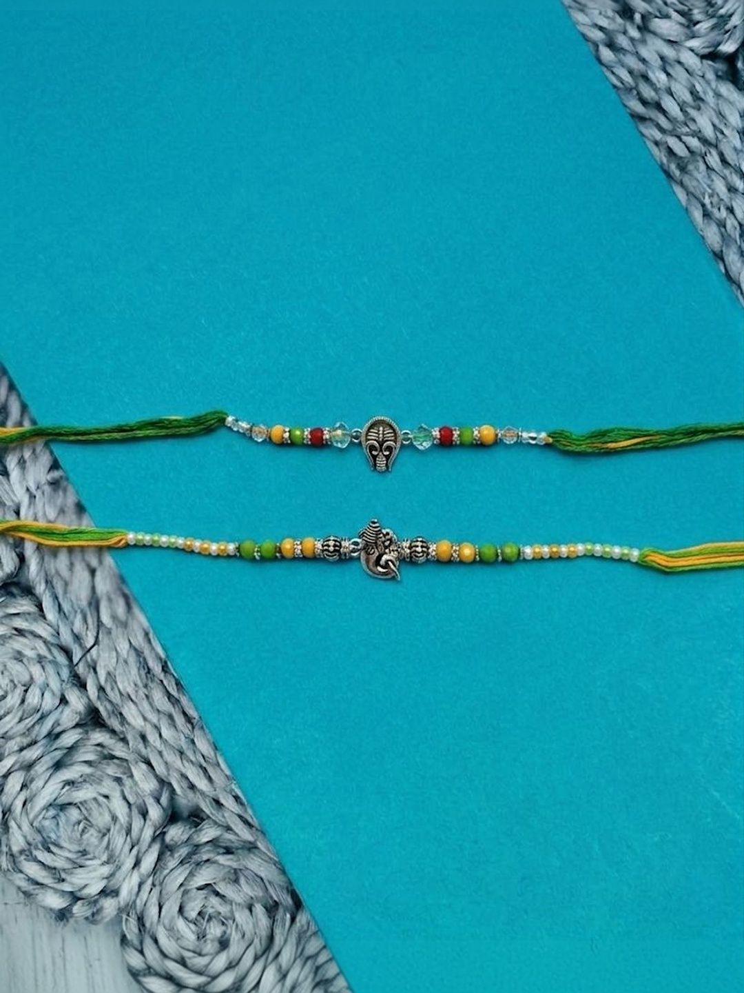 Dhiyona Set Of 2 Multicolor Religious Thread Rakhi With Roli Chawal Chandan Mishri