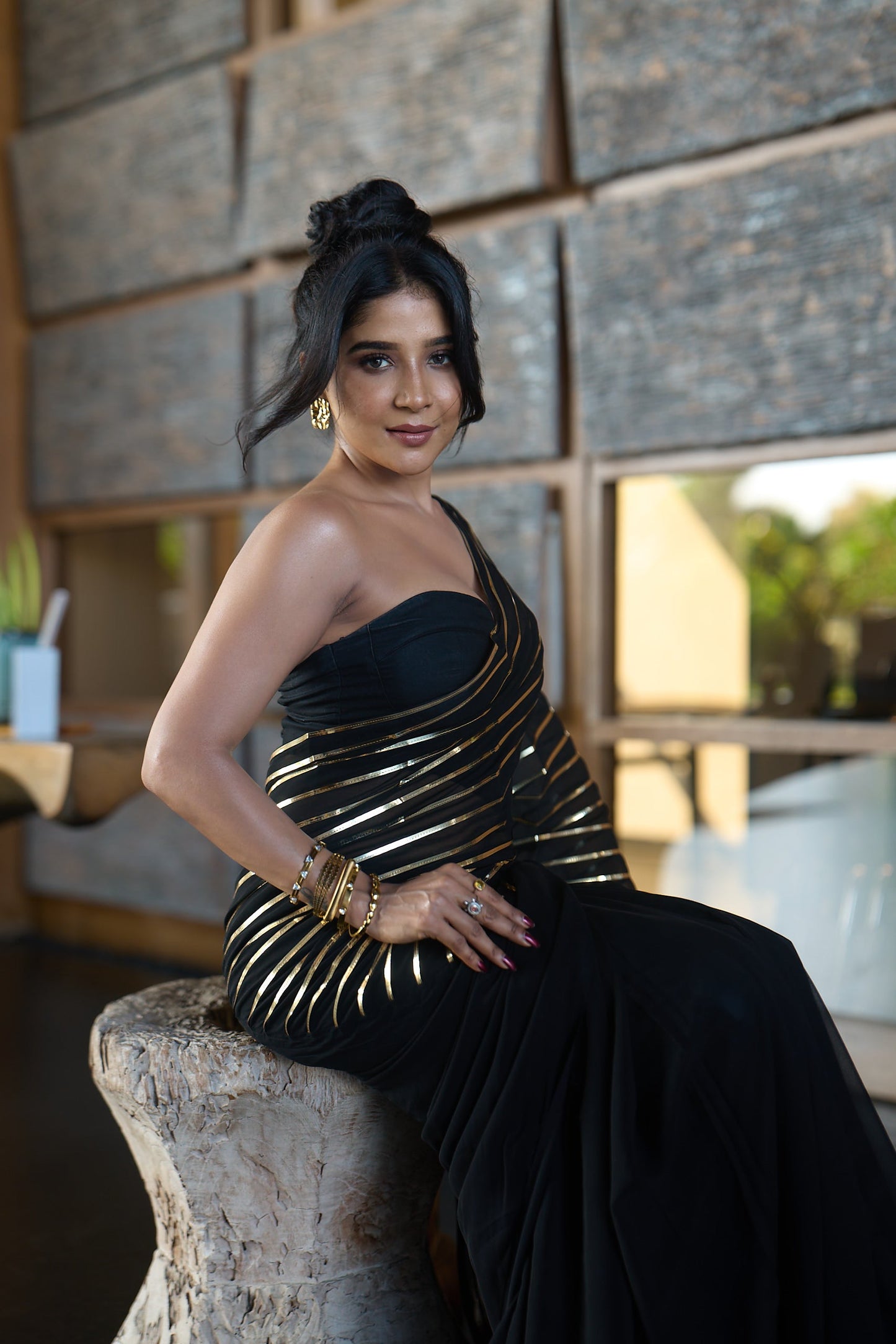 Dhiyona ST Black And Gold Impression Georgette Saree