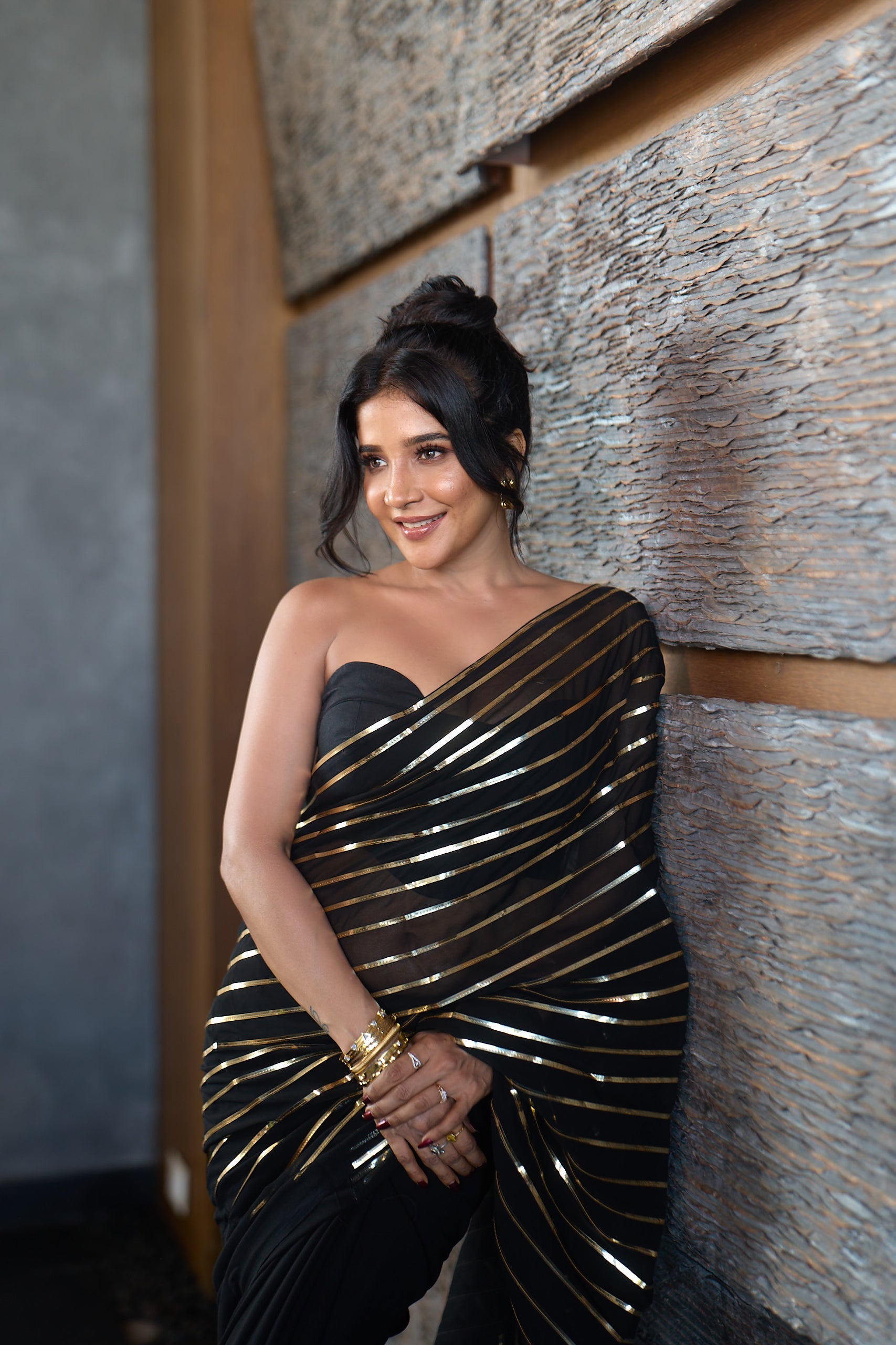 Dhiyona ST Black And Gold Impression Georgette Saree