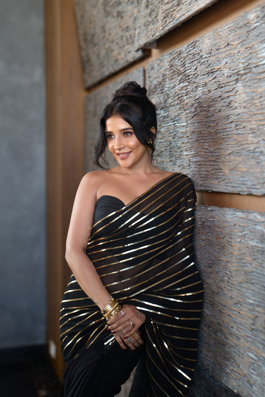 Dhiyona ST Black And Gold Impression Georgette Saree