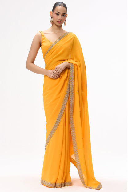 Dhiyona ST Turmeric Yellow Drapy Georgette Saree with Diamonds and Self Blouse Fabric