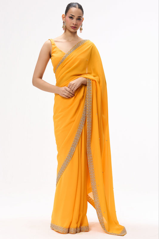 Dhiyona ST Turmeric Yellow Drapy Georgette Saree with Diamonds and Self Blouse Fabric