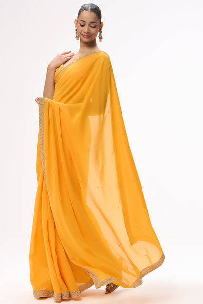 Dhiyona ST Turmeric Yellow Drapy Georgette Saree with Diamonds and Self Blouse Fabric