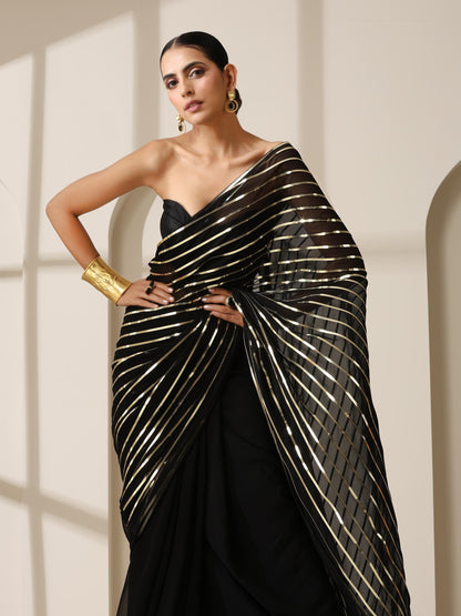 Dhiyona ST Black And Gold Impression Georgette Saree