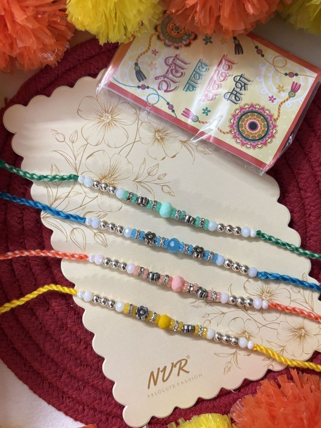 Dhiyona Set Of 4 Multicolor Artificial Beads Thread Rakhi With Roli Chawal Chandan Mishri