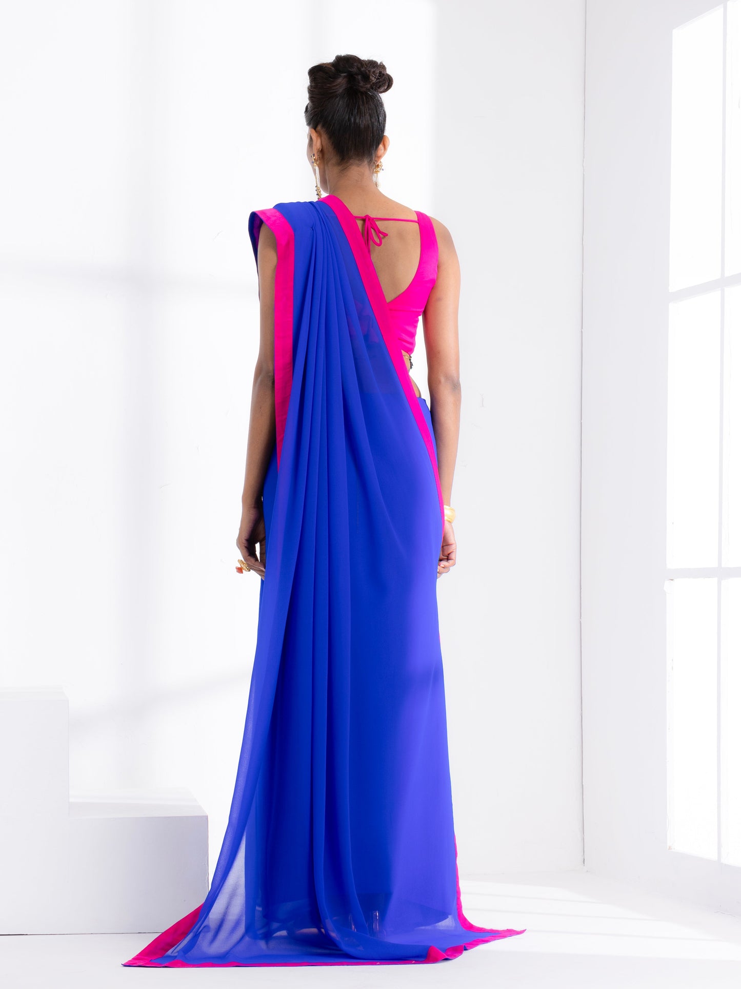 Dhiyona ST Megawatt Blue Georgette Saree with Pink Posh Fabric Border & Blouse Fabric