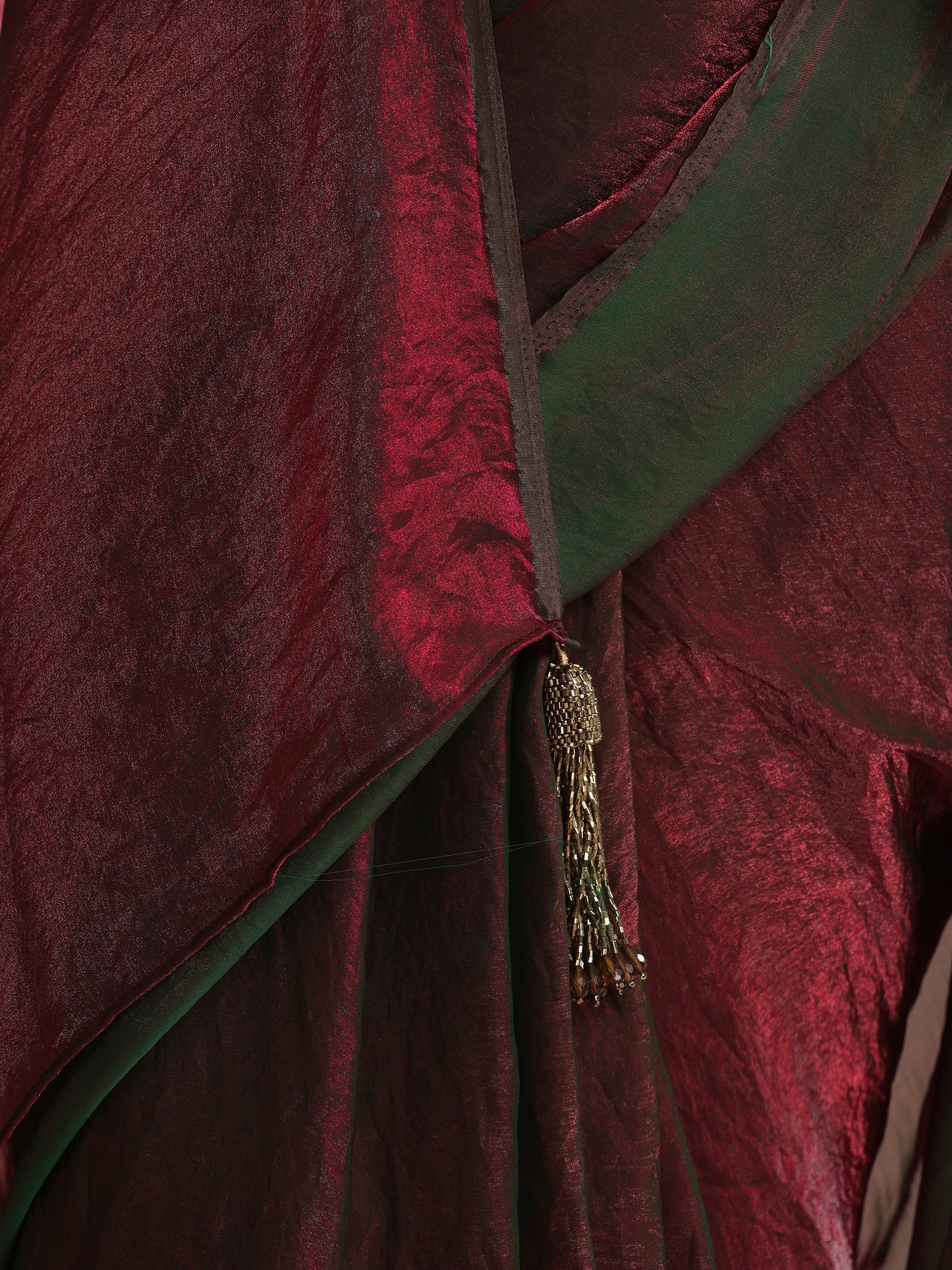 Dhiyona ST Enigmatic Elegance Saree – Dual-Shade Maroon-Green Metallic Satin with Pendants & Self Blouse Fabric