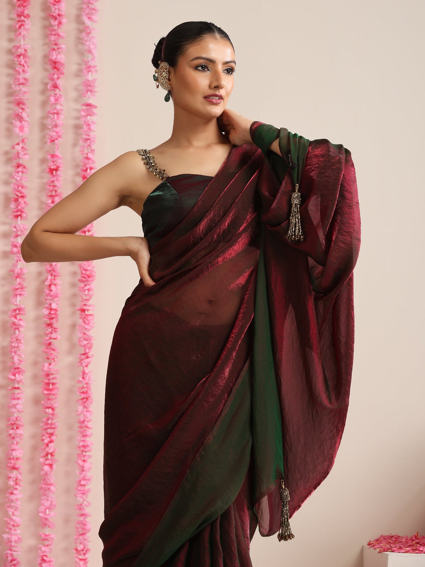 Dhiyona ST Enigmatic Elegance Saree – Dual-Shade Maroon-Green Metallic Satin with Pendants & Self Blouse Fabric