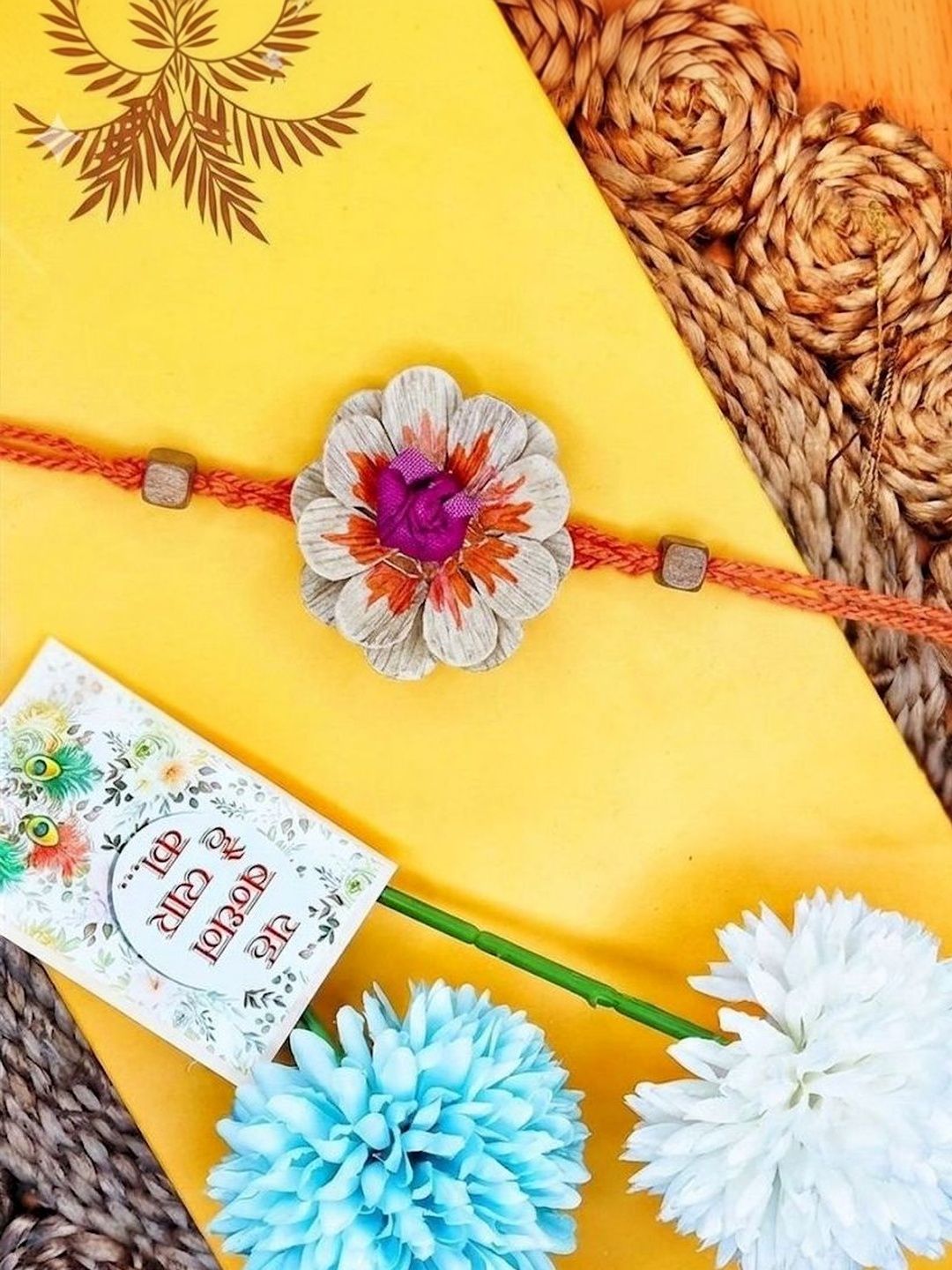 Dhiyona Multicolor Floral Design Plant Seed Rakhi With Roli Chawal Chandan Mishri