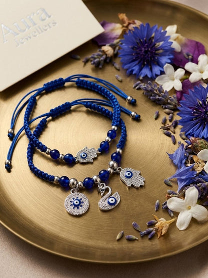 Dhiyona Set Of 2 Blue & Silver Evil Eye Design Bhaiya Bhabhi Rakhi With Roli Chawal Chandan