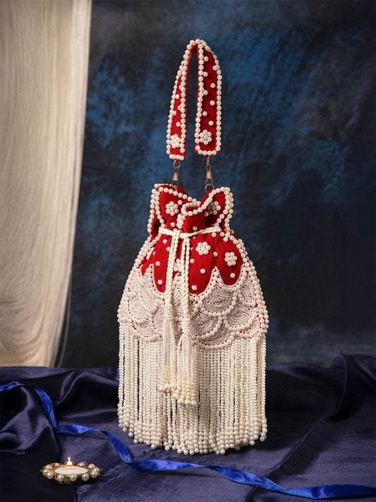Dhiyona NR Women Embroidered Tasselled Potli Clutch