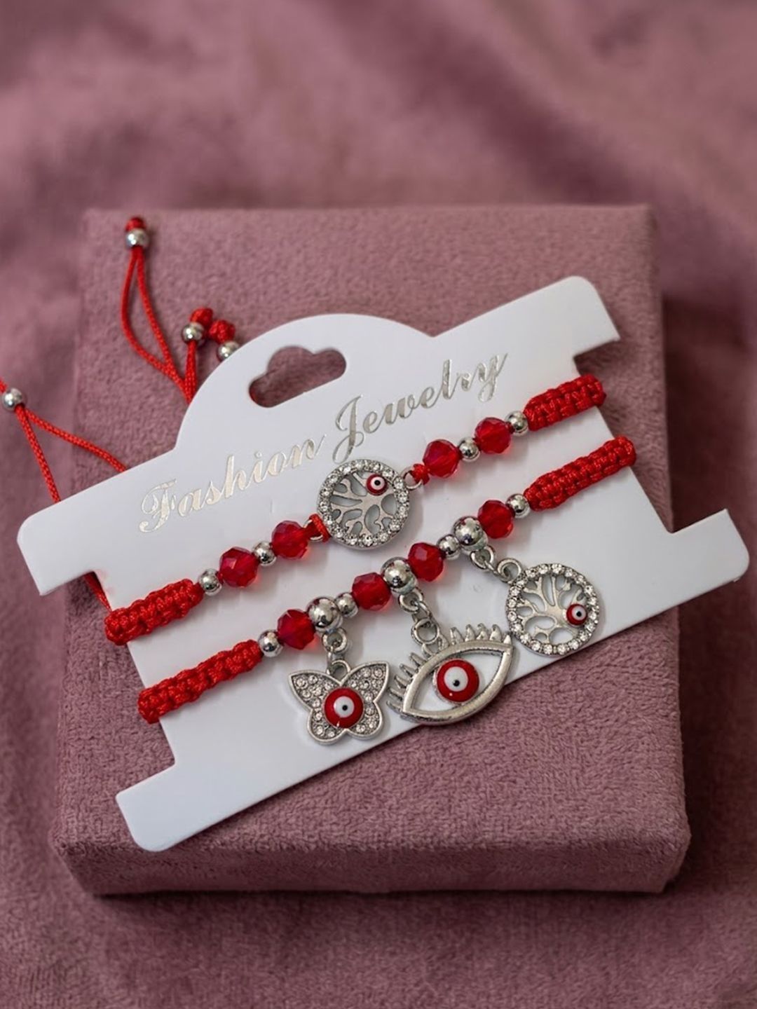 Dhiyona Set Of 2 Red & Silver Evil Eye Design Bhaiya Bhabhi Rakhi With Roli Chawal Chandan