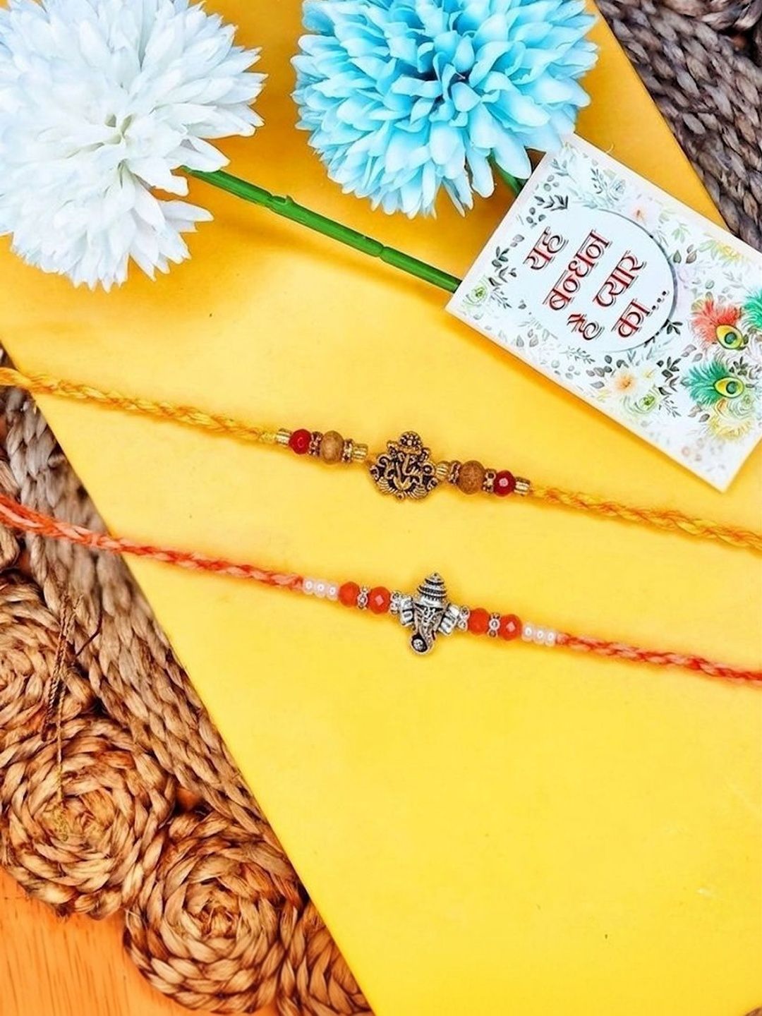 Dhiyona Set Of 2 Multicolor Religious Thread Rakhi With Roli Chawal Chandan Mishri