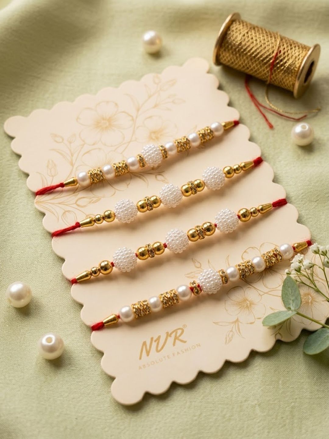 Dhiyona Set Of 4 White Pearls & Red Thread Rakhi With Roli Chawal Chandan Mishri