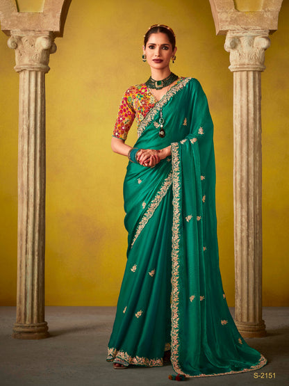 Dhiyona KM Women Emerald Green Saree With A Vibrant Floral Embroidered Blouse