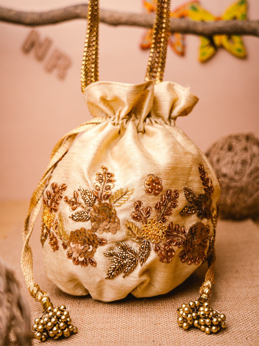 Dhiyona NR Women Cream Embroidered Potli Bag