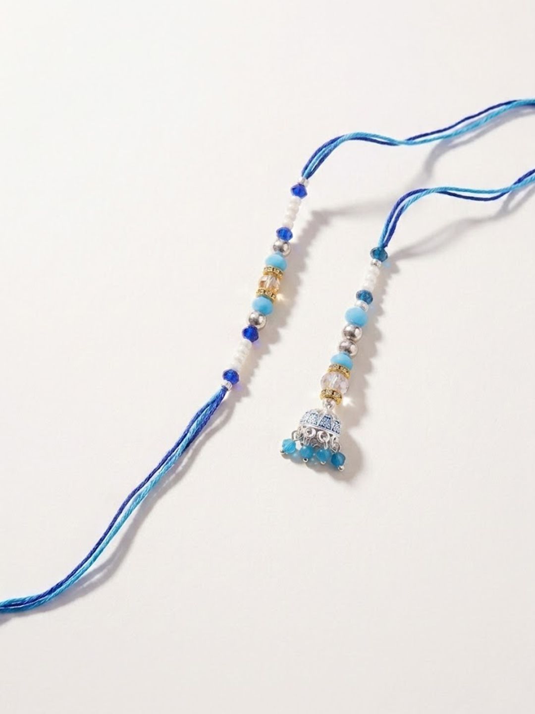 Dhiyona Set Of 2 Blue Artificial Beads Jhumka Design Bhaiya Bhabhi Rakhi With Roli Chawal