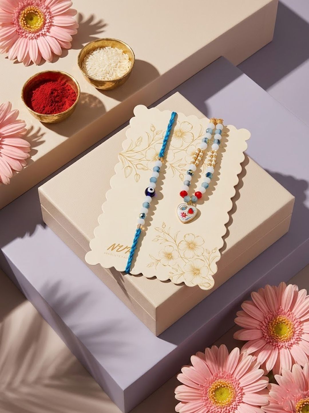 Dhiyona Set Of 2 Evil Eye Beaded Gold Toned Bhaiya Bhabhi Rakhi With Roli Chawal Chandan