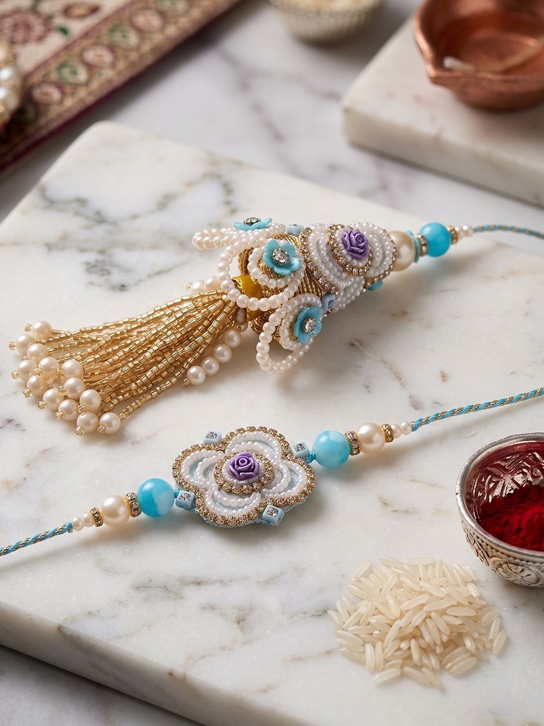 Dhiyona Set Of 2 Pearls & Artificial Stones Floral Bhaiya Bhabhi Rakhi With Roli Chawal