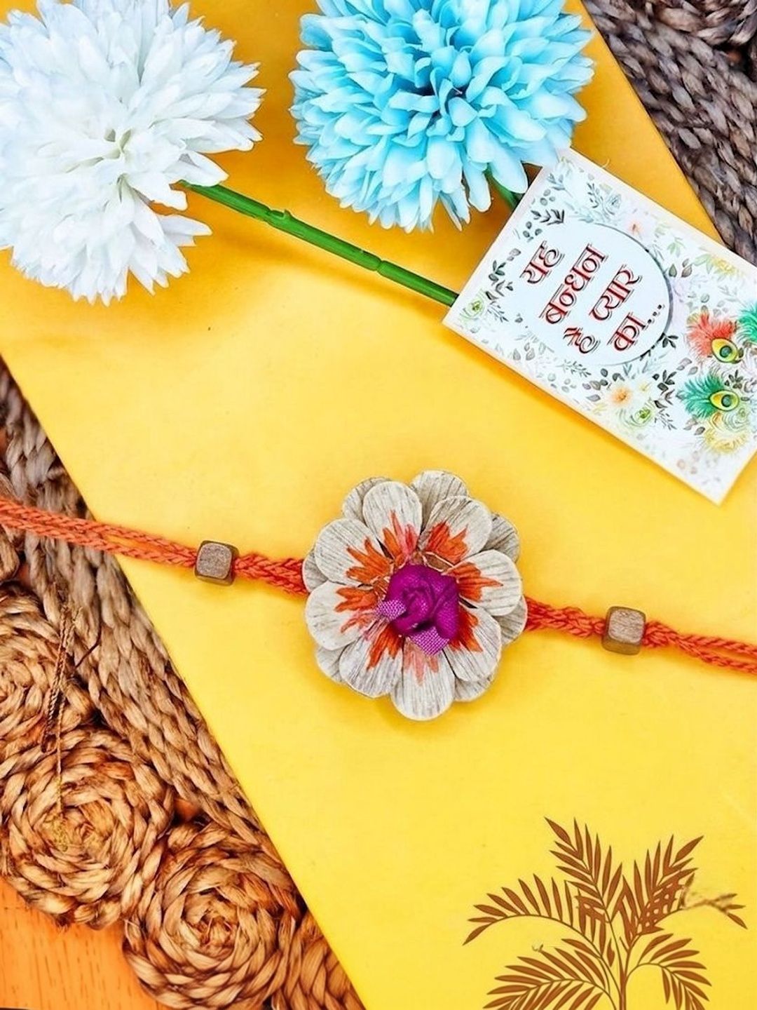 Dhiyona Multicolor Floral Design Plant Seed Rakhi With Roli Chawal Chandan Mishri