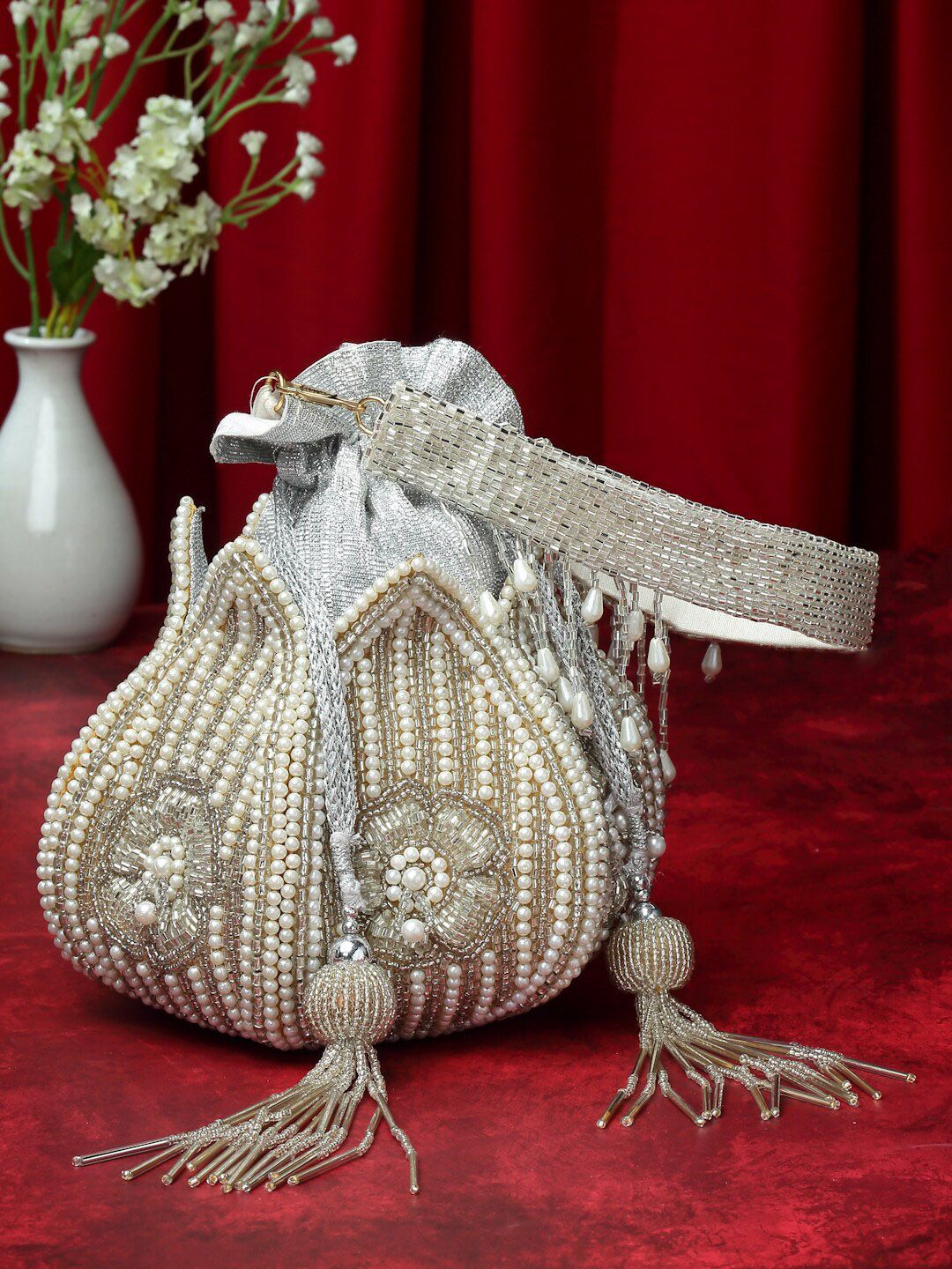 Dhiyona NR Embellished Tasselled Potli Clutch