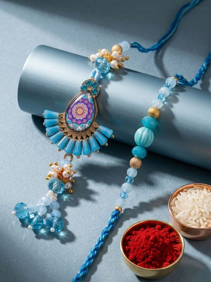 Dhiyona Set Of 2 Transparent Beads Pear Shape Bhaiya Bhabhi Rakhi With Roli Chawal Chandan
