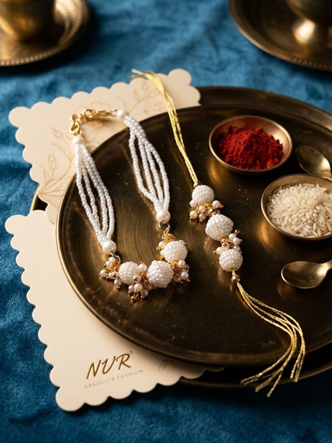 Dhiyona Set Of 2 Gold Toned & White Pearls Bhaiya Bhabhi Rakhi