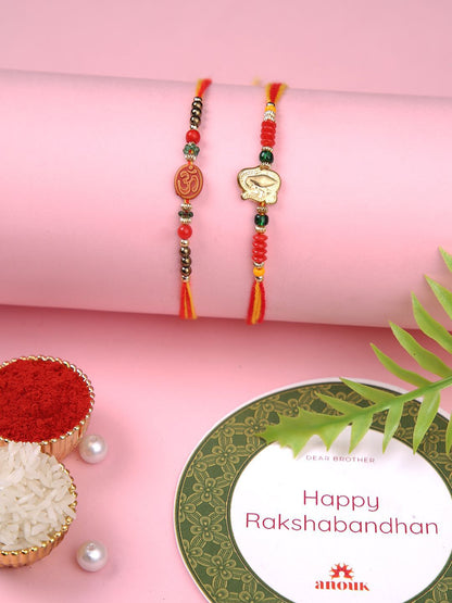 Dhiyona Set Of 2 Red Om & Lord Ganesh Beaded Rakhi With Roli Rice & Greeting Card