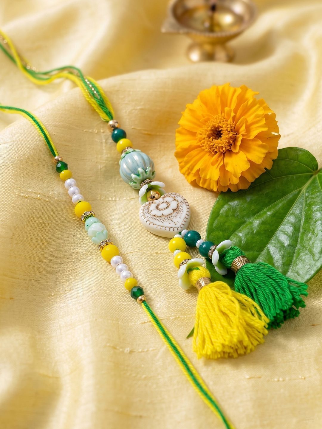 Dhiyona Set Of 2 Green & Yellow Beaded Heart Shape Bhaiya Bhabhi Rakhi With Roli Chawal
