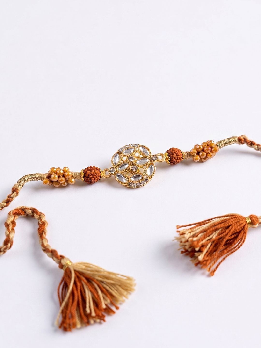 Dhiyona Rudraksh & Kundan Studded Gold Toned Thread Rakhi With Roli Chawal Chandan Mishri