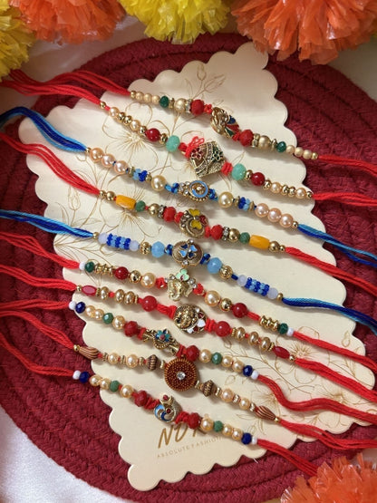 Dhiyona Set Of 10 Artificial Stones & Beads Thread Rakhi With Roli Chawal Chandan Mishri